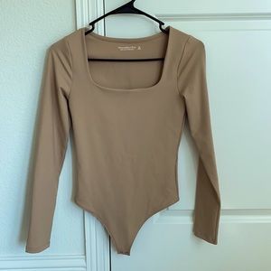Tan long sleeve body suit